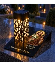 Gięty Święty Józef Opiekun — na nagrobku wieczorem