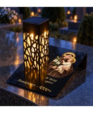 Gięty Święty Antoni z Dzieciątkiem — na nagrobku wieczorem
