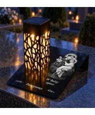 Gięty Święty Antoni z Dzieciątkiem mono — na nagrobku wieczorem